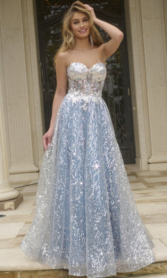 A woman stands outside wearing the Jovani 08417: a strapless long sequin prom ball gown in blue, featuring a sheer glitter overlay and floral embellished bodice.