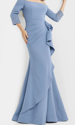 A woman wears the Jovani 08699 long formal dress in light blue, featuring an off-shoulder neckline, three-quarter sleeves with silver cuffs, and a draped bow detail at the waist.