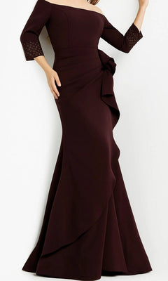 A woman wearing the Jovani 08699 long formal dress in plum, featuring an elegant off-shoulder design, three-quarter sleeves, a floor-length silhouette, and a large side bow detail.