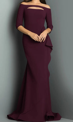 A woman wearing the Long Formal Dress: Jovani 09623—a sophisticated, floor-length plum gown with an off-the-shoulder neckline, three-quarter sleeves, and an elegant side detail—stands against a plain gray background.