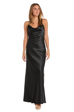A woman in the Cowl-Neck Long Satin Prom Dress: Morgan 10037N with spaghetti straps and nude heels stands against a white background.
