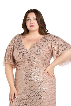A woman models the R&M Richards 1011W Plus-Size Sequin Formal Dress in rose gold with short flutter sleeves against a white background.