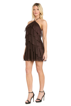 A woman wearing the Morgan 10196 Short Homecoming Dress—a sleeveless, dark brown mini dress with ruffled tiers and a halter neckline—paired with black high-heeled sandals, stands against a white background. This chic look is perfect for homecoming.