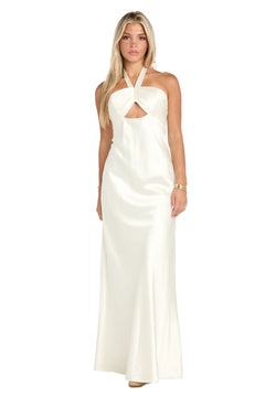 A woman models the Long Satin Ivory Formal Dress: Morgan 10215, featuring a halter neckline and front cutout, standing against a plain white background.