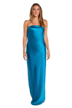 A woman faces forward in the Long Simple Satin Prom Dress: Morgan 10219, a strapless, floor-length bright blue sheath gown, set against a plain white background.