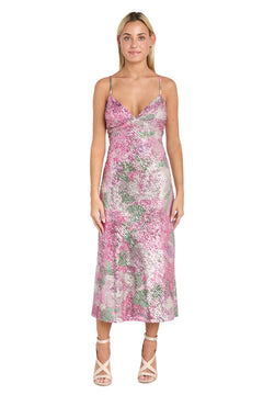 A woman stands facing forward against a white background, wearing the Morgan 10253 Semi-Formal Floral Sequin Dress—sleeveless, tea-length with thin straps—and light-colored strappy heels.