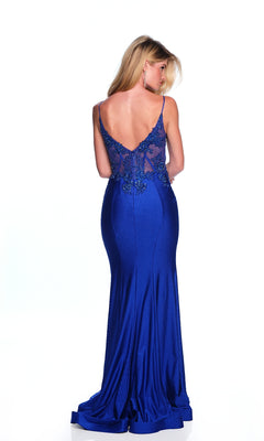 Woman wearing the Sheer-Waist Long Prom Dress (Dave & Johnny A10442), a floor-length royal blue mermaid gown with sheer, embellished back and delicate beaded embroidery, standing and facing away against a white background.