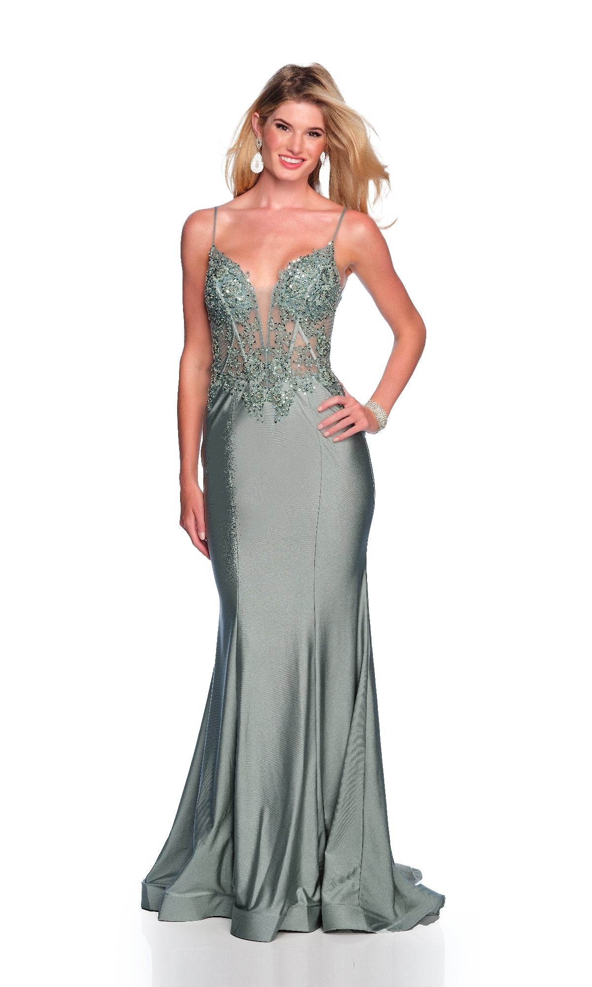 Woman wearing the Sheer-Waist Long Prom Dress: Dave & Johnny A10442—an elegant floor-length, silver-green mermaid gown with thin straps, sheer bodice accents, and beaded embroidery—standing against a white background.