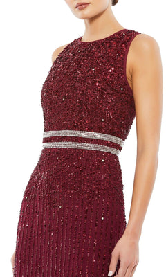 A woman wears the Short Sequin Wedding Guest Dress: Mac Duggal 10509, a sleeveless burgundy dress with sequin embellishments and two silver waist bands.