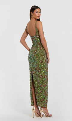 A woman faces away, modeling the Mac Duggal 10755 Sequin Formal Dress with Back Slit and gold high-heeled sandals, set against a plain white background.