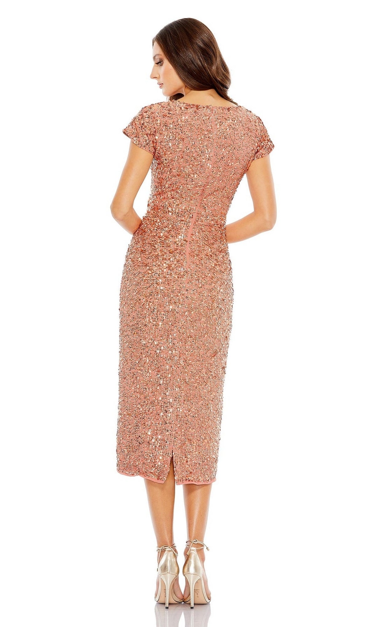 A woman stands facing away in the Mac Duggal 10766 Midi Sequin Wedding Guest Dress with strappy high-heeled shoes against a white background.