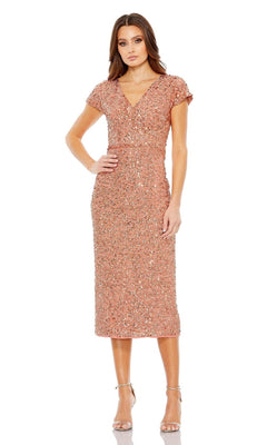 A woman wears the Mac Duggal 10766 Midi Sequin Wedding Guest Dress in rose gold with a V-neckline and strappy high-heeled sandals, standing against a plain white background.