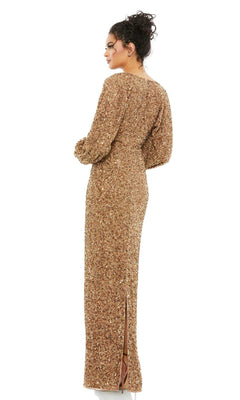 A woman stands facing away, wearing the Mac Duggal 10791 Sequin Long Sleeve Formal Gown with a back slit, her hair in a loose updo.