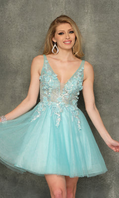 A woman wears the Sheer-Bodice Short Homecoming Dress—a sleeveless, light blue A-line tulle dress with floral accents—standing against a textured gray background and smiling at the camera.