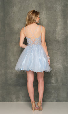 A woman faces away, wearing the Sheer-Bodice Ice Blue Short Homecoming Dress 10844 featuring a lace-up back, spaghetti straps, and fit-and-flare design with nude heels against a plain gray background.
