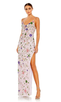 A woman wears the Mac Duggal Long Formal Dress 10893—a light pink, floor-length gown with thin straps, floral embroidery, and a high slit—paired with strappy heeled sandals.
