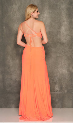 A woman stands facing a textured gray wall, wearing the Dave and Johny One-Shoulder Long Prom Dress 10974 in coral, its elegant backless design and crisscross straps accentuating her silhouette.