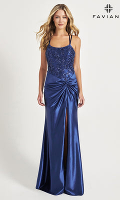 A woman models the Side-Knot Faviana Long Satin Prom Dress 11005 in royal blue with a high slit, floral details, and mermaid silhouette, standing against a plain background with "FAVIAN" displayed in the top right corner.