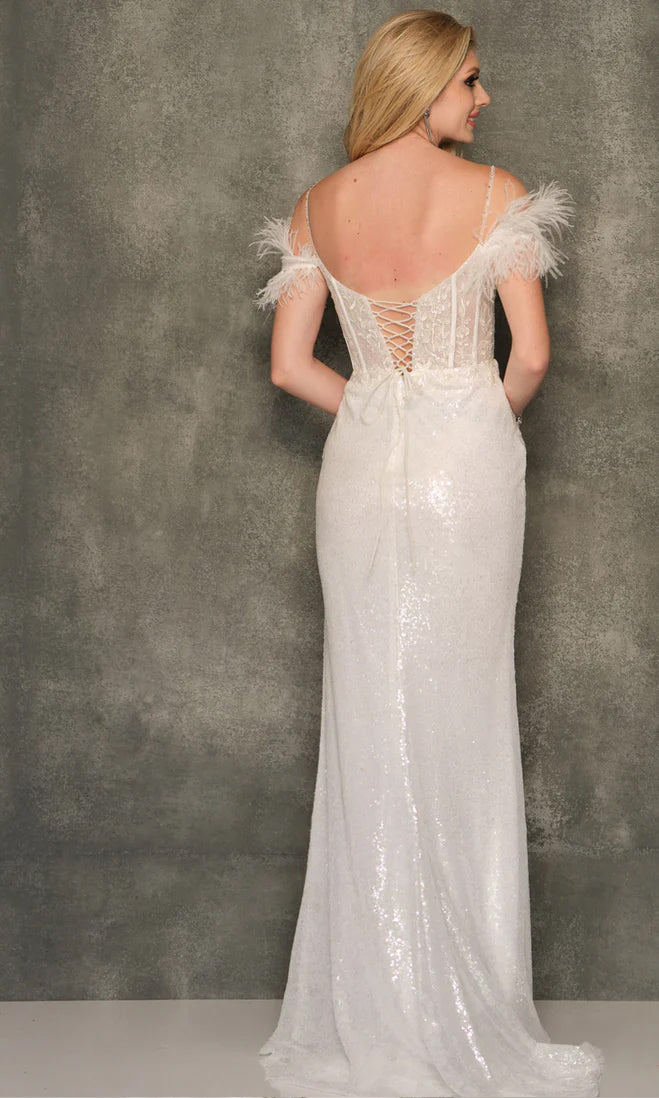A woman faces away in the Dave and Johnny Long Feather Prom Dress 11007, featuring white sequins, feathered off-the-shoulder sleeves, and a lace-up back, standing against a gray textured background.