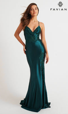 A woman models the Lace-Applique Faviana V-Neck Long Prom Dress 11010, a sleeveless deep teal satin gown with sequin lace details and a fitted silhouette, standing against a plain white background with “FAVIÁN” in the corner.