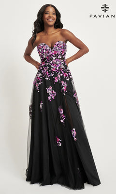 A woman stands smiling against a plain background, wearing the Faviana Long Black Strapless Prom Dress 11028 with elegant pink and purple floral embroidery. The "Faviana" brand name appears in the top right corner.