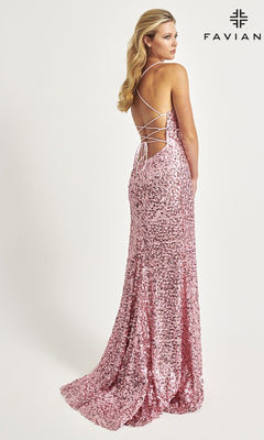 A woman poses against a plain background in the Faviana Empire-Waist Long Sequin Prom Dress 11033—a pink, backless, floor-length gown with crisscross straps. The brand name "FAVIAN" appears in the top right corner.