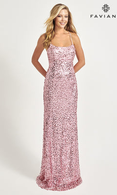 A woman smiles with hands clasped, wearing the Faviana Empire-Waist Long Sequin Prom Dress 11033 with thin straps. She stands against a plain white background with the Faviana logo in the top right, showcasing this elegant formal gown.