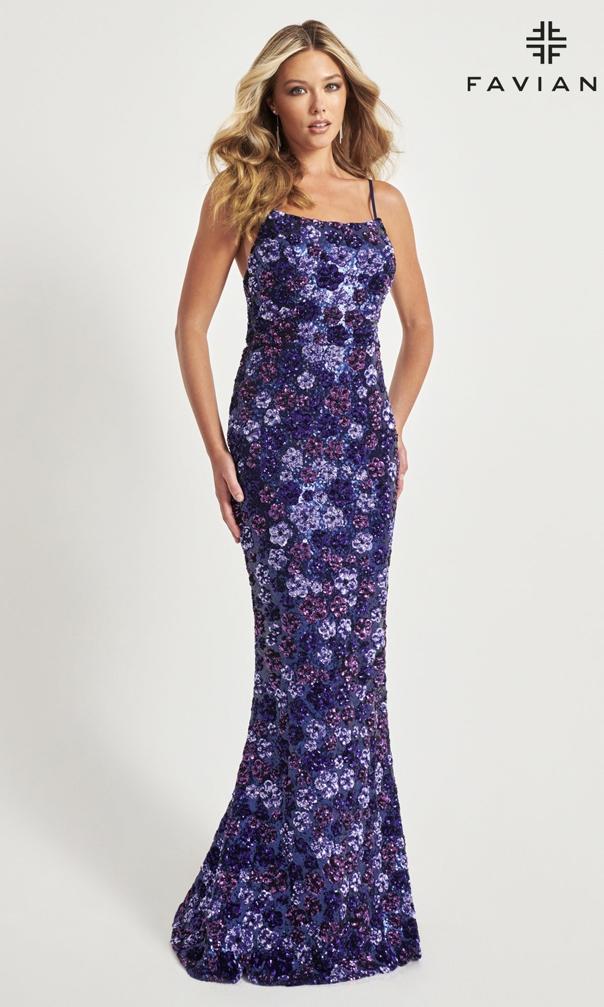 A woman wears the Faviana Long Floral-Sequin Prom Dress 11037, a fitted, floor-length purple gown with thin straps and delicate sequin flowers, posing against a plain white background. The Faviana logo is in the top right corner.