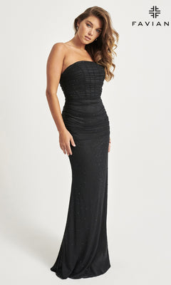 A woman poses in the Faviana Corset Long Strapless Prom Dress 11040, a fitted black evening gown with subtle embellishments, against a plain white background with the "FAVIAN" logo in the top right corner.