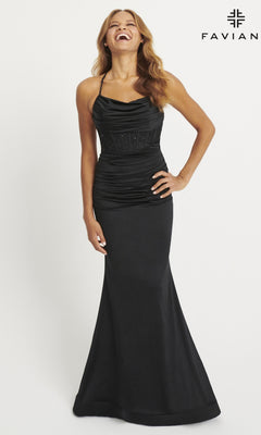 Smiling with one hand on her hip, a woman models the Faviana Cowl-Neck Long Corset Prom Dress 11043 in black against a plain white background, with the Faviana logo displayed in the top right corner.