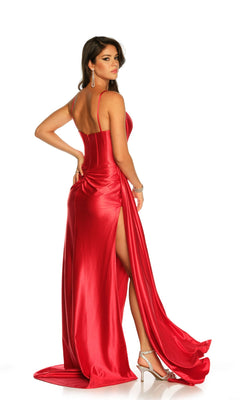 A woman poses against a white background in the Dave & Johnny Long Satin Prom Dress with Side Sash—shiny red satin with a corset bodice and high slit—paired with silver heels and long earrings.