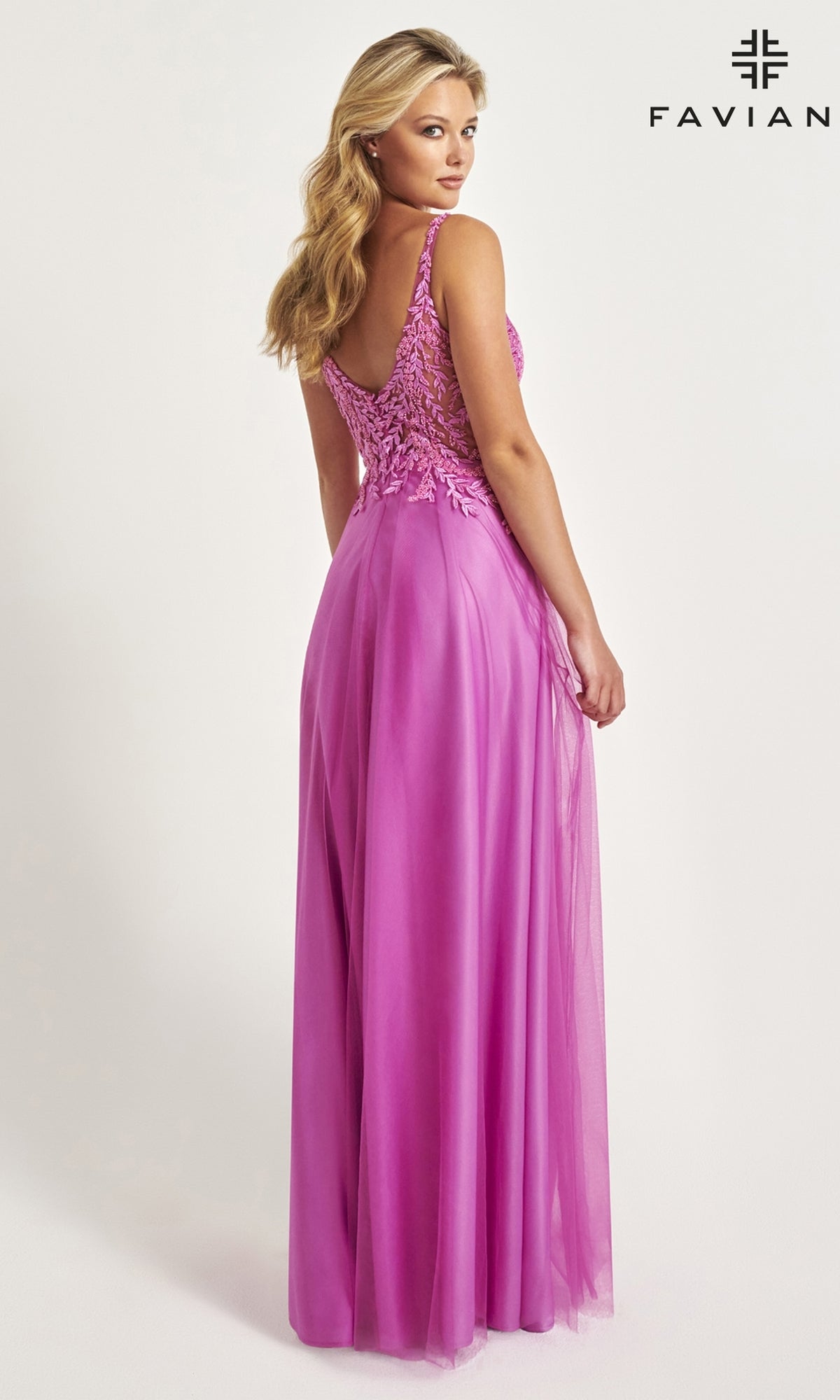A woman models the Faviana Sheer-Bodice Long Tulle Prom Dress 11055, a sleeveless magenta gown with lace details, standing against a light background. The brand name 