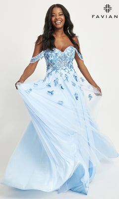 A woman smiles while holding the skirt of a flowing light blue Faviana Off-Shoulder Long A-Line Prom Dress 11059 with floral appliqué details. The "FAVIAN" logo appears in the top right corner.