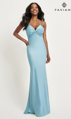 A woman models the Faviana Twist-Knot Long Satin Prom Dress 11066 in light blue, floor-length style, posing against a white background with the Faviana logo in the top right corner.