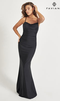 A woman models the Cowl-Back Faviana Long Black Prom Dress 11072, featuring thin straps and a ruched bodice, against a plain light background. The Faviana logo is shown in the top right corner.