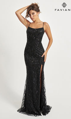 A woman poses against a white backdrop in the Faviana Long Beaded Prom Dress 11075, a fitted black gown with sequin embellishments, thin straps, and a thigh-high slit. The "FAVIAN" logo showcases this stunning designer evening dress.