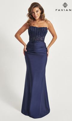 A woman wears the Corset Faviana Strapless Long Formal Dress 11081 in navy blue, featuring a beaded sheer bodice and floor-length satin skirt; "Faviana" logo appears in the top right corner.
