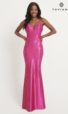 A woman models the Faviana Tonal-Lace Long Prom Dress 11082 in fitted fuchsia stretch satin with floral embroidery, deep V-neck, and wide straps. The elegant, floor-length gown is showcased against a plain white background.