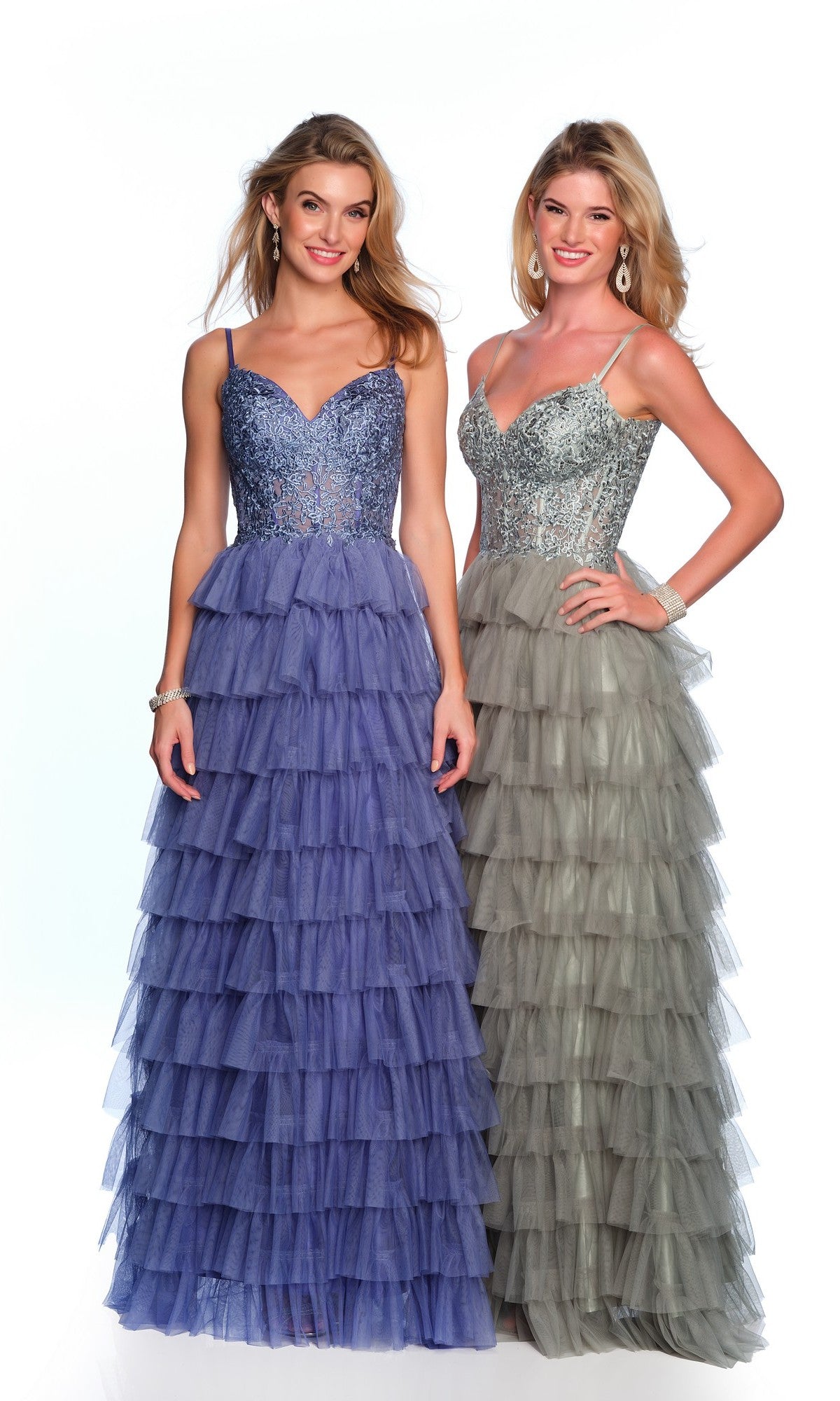 Two women stand side by side in floor-length formal designer dresses with beaded bodices; one wears the Dave and Johnny Long Tiered Prom Dress 11148 in purple, the other a silver-gray gown.
