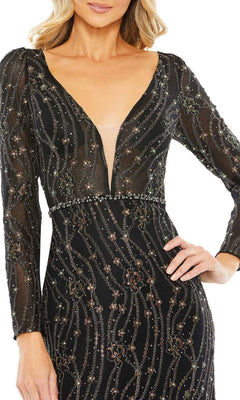 A woman wearing the Long Formal Dress 11159 by Mac Duggal—a black, long-sleeve evening gown with a deep V-neck and sequin embellishments—stands with one hand on her hip.