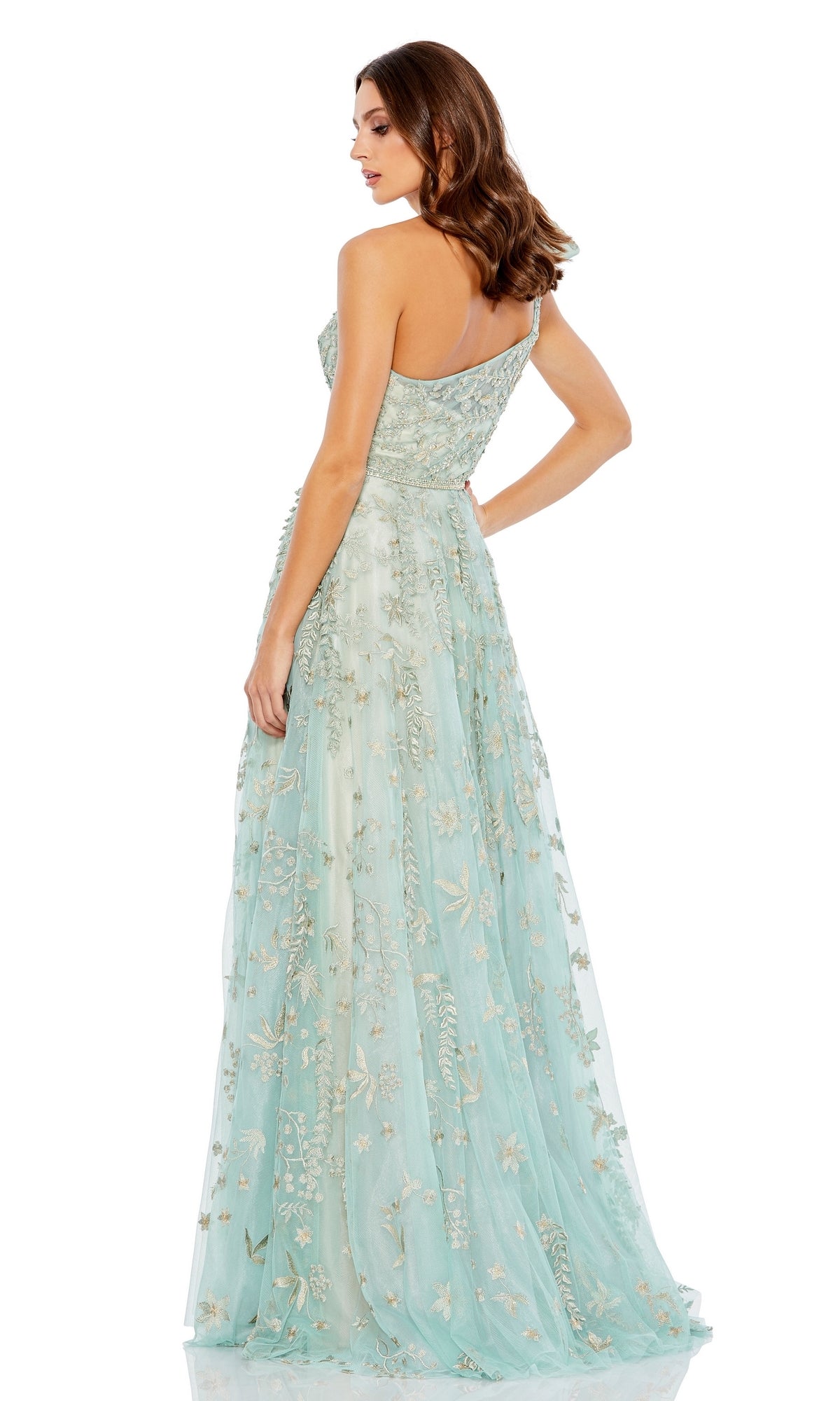 A woman stands with her back turned, glancing over her shoulder in the Mac Duggal 11177 Sage One-Shoulder Formal Dress.
