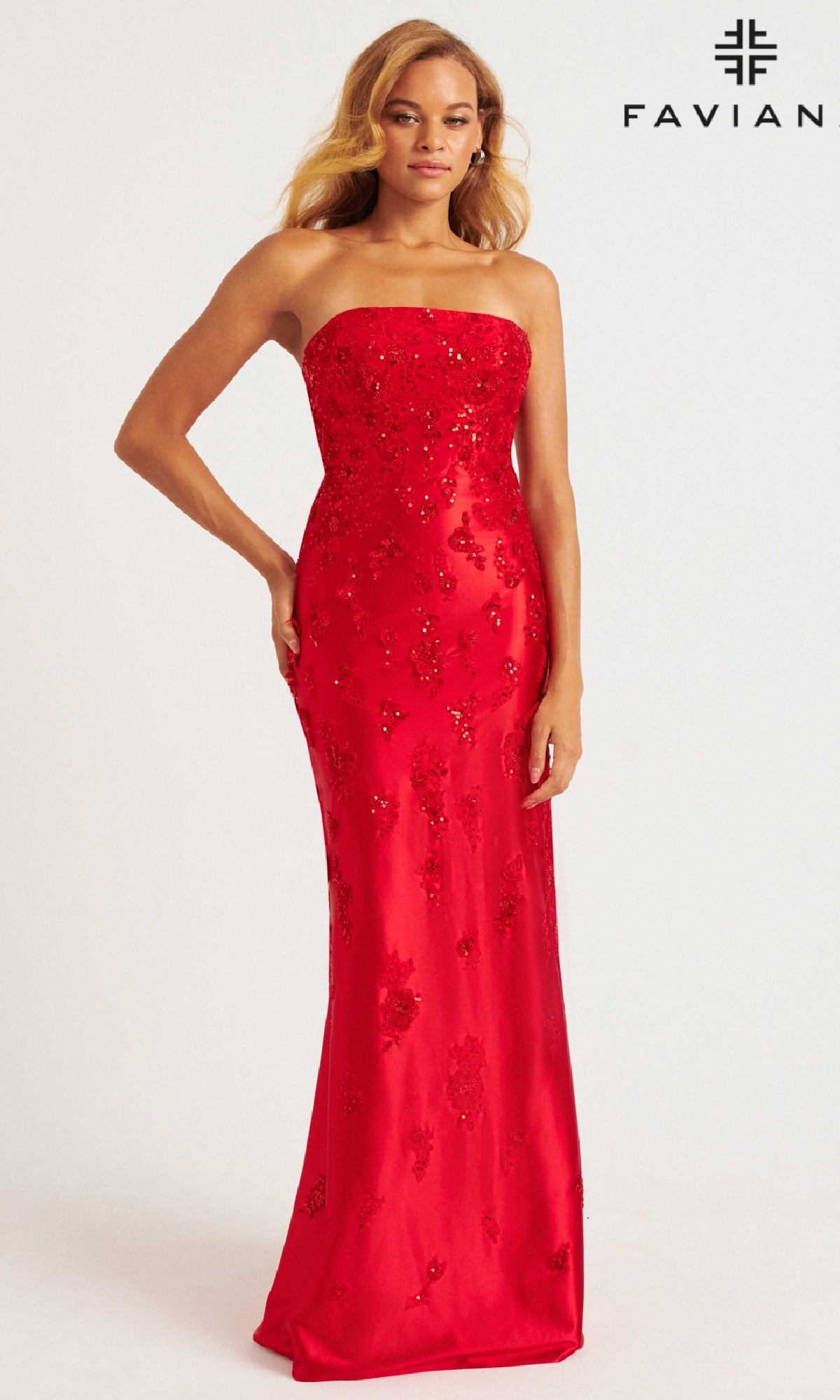 A woman wears the Strapless Satin Prom Dress: Faviana 11228, made from stretch satin with beaded details. The background is plain white, with the 
