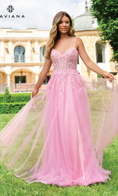 A woman in the Faviana 11230 long lace-bodice a-line prom dress stands on grass before a historic building.