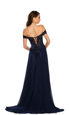 A woman models the Dave and Johnny Off-Shoulder Navy Prom Dress 11242, featuring floral bodice embellishments, lace-up back, and a flowing skirt, against a white background.
