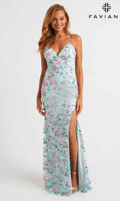 Woman wearing Faviana 11263, a light blue floral-patterned long prom dress with a v-neckline and thigh-high slit, standing and smiling against a plain white background.