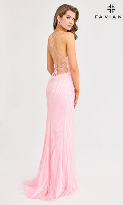 A woman models the Faviana 11270 long prom dress, featuring a light pink, floor-length beaded design with crisscross straps and a lace-up back, against a white background. "FAVIAN" and its logo appear in the top right corner.