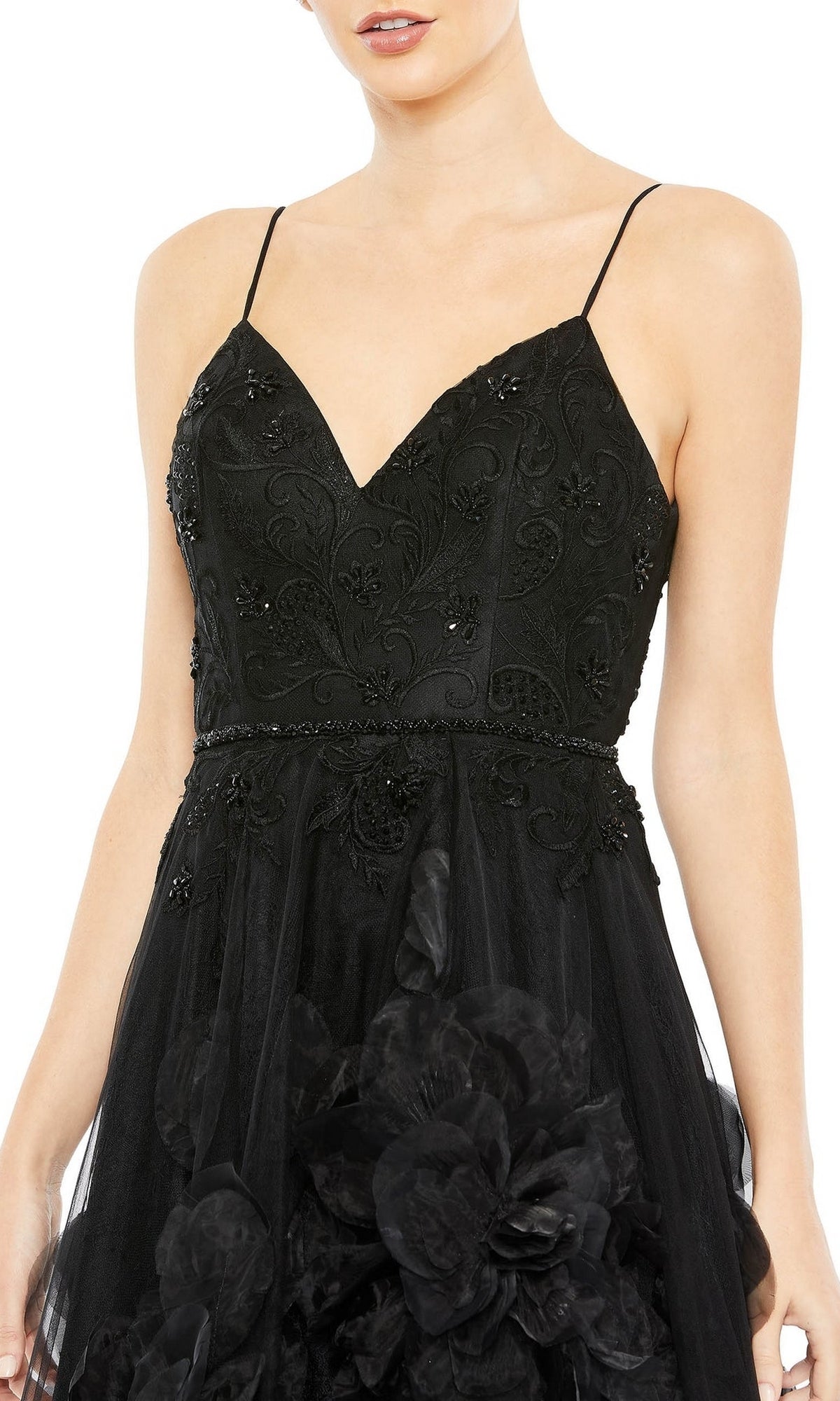 Woman models the Long Black Floral Formal Dress: Mac Duggal 11293—featuring a sweetheart neckline, thin straps, floral embroidery on the bodice, and bold black floral skirt accents; ideal as a prom or evening gown.
