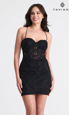 A woman stands smiling against a plain background in a fitted black, strapless dress with beaded details. The “FAVIAN” logo appears at the top right. Inspired by the Strappy-Back Short Lace Hoco Dress: Faviana 11301’s open-back design.