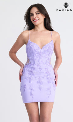 A woman smiles against a plain background in the Faviana 11303 Short Beaded Homecoming Dress—a fitted, light purple, sleeveless mini dress with floral embroidery and open back. "FAVIANA" and logo are displayed in the top right corner.
