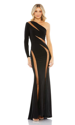A woman stands against a white background wearing the Cut-Out Long Black Formal Dress: Mac Duggal 11311, which features a one-shoulder silhouette and multiple angular cutouts along the torso and legs.